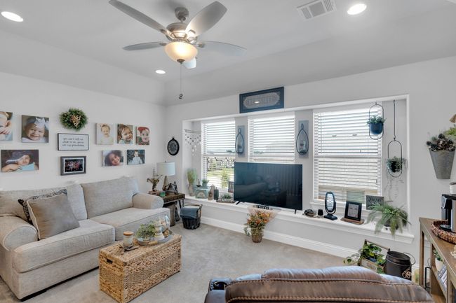 Upstairs living area Carpeted featuring ceiling fan and recessed lighting | Image 25
