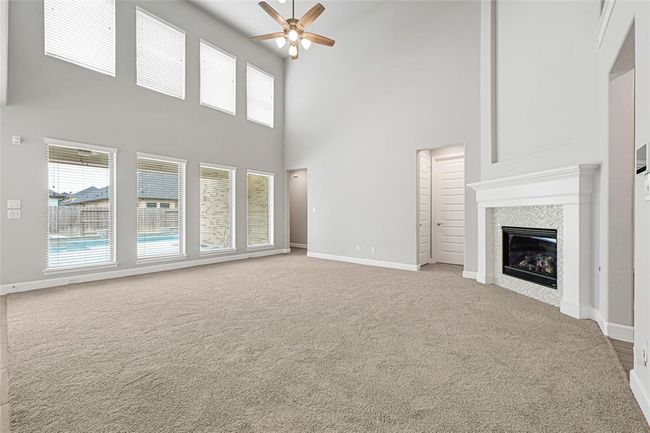 Natural lighting. Views of the patio deck and pool. | Image 8