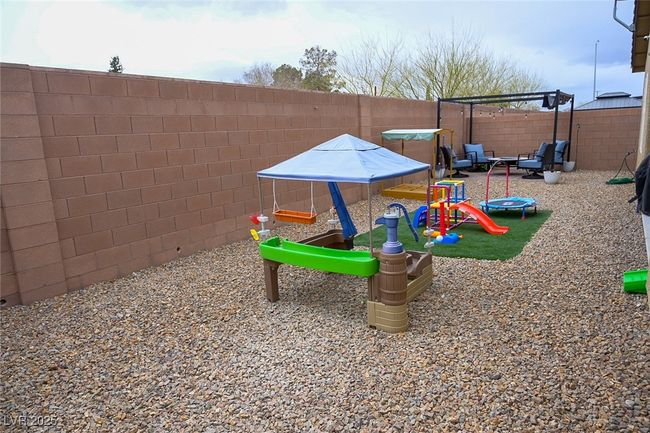 View of play area featuring a fenced backyard | Image 31