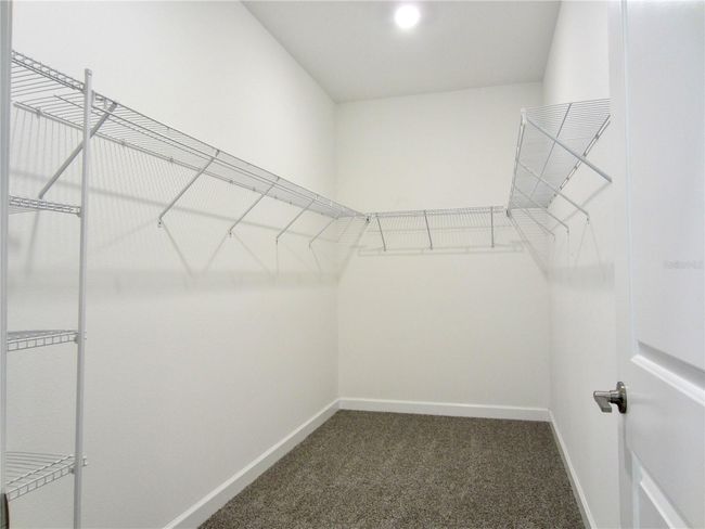 from Master Bathroom enter into a big walk in closet | Image 24
