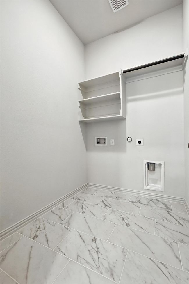 Laundry area featuring electric dryer hookup, hookup for a washing machine, hookup for a gas dryer, and marble finish floors | Image 29