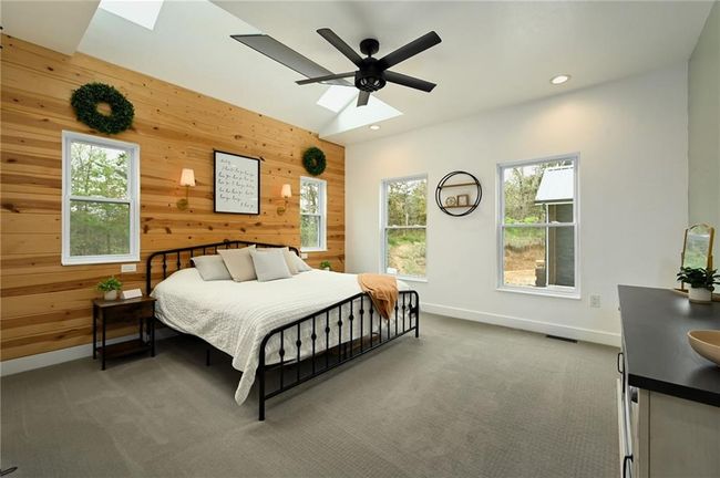 Primary bedroom on main living. An abundance of natural light to showcase the beauty of bringing the outdoors in... | Image 25