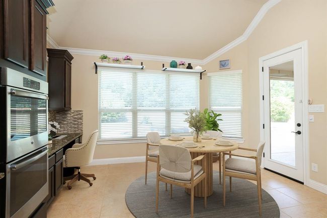 Full backyard views and exterior door to covered patio | Image 21
