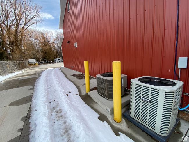Exterior details with central AC unit and fence | Image 17