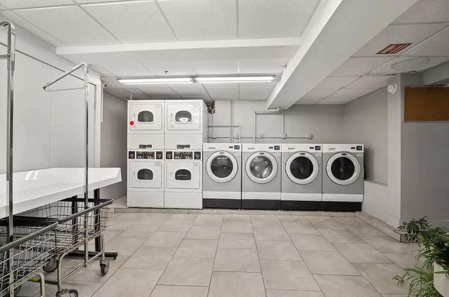 Community laundry room with washing machine and dryer and stacked washing maching and dryer | Image 9