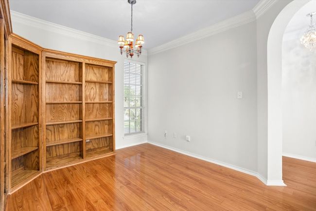 Just off the entry is a wonderful flex room with lots of built-ins. This would make a great office, play area or additional living space | Image 6