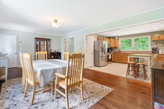 Dining area with light wood finished floors and recessed lighting | Image 14