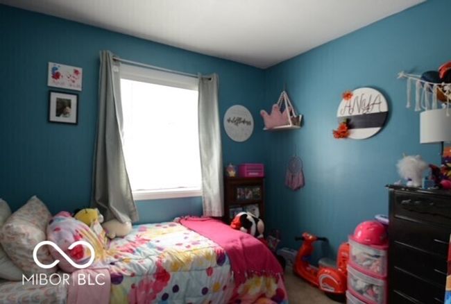 view of carpeted bedroom | Image 17