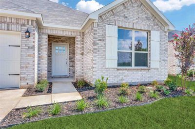 Entrance to property featuring a garage | Image 2