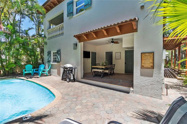 Paved patio and heated pool w/ covered patio to enjoy dining outside | Image 35