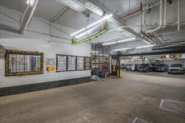 Parking garage featuring concrete block wall | Image 16
