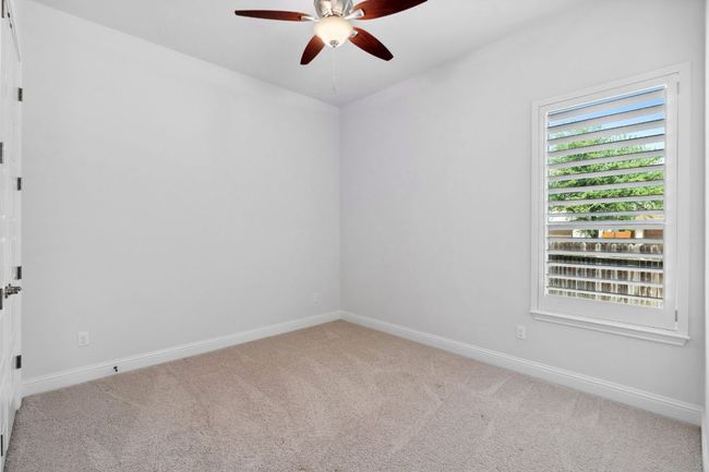 Bedroom 3 - Windows throughout the home are equipped with shutters. | Image 27