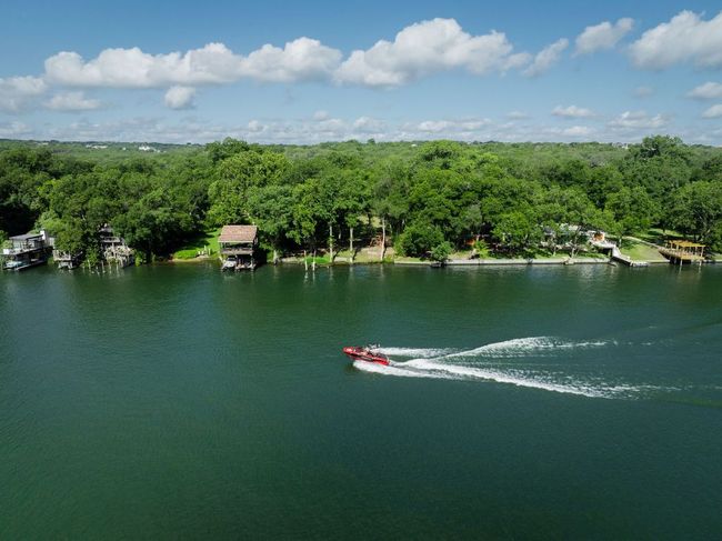 Water view featuring a heavily wooded area | Image 28