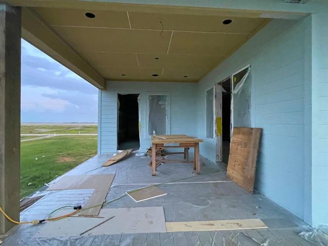 Facing back toward the house from the screened-in patio area, this view showcases how indoor and outdoor living will blend seamlessly — maximizing comfort, privacy, and panoramic views. | Image 35