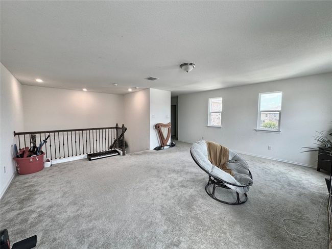 Unfurnished room with an upstairs landing, carpet flooring, and recessed lighting | Image 24