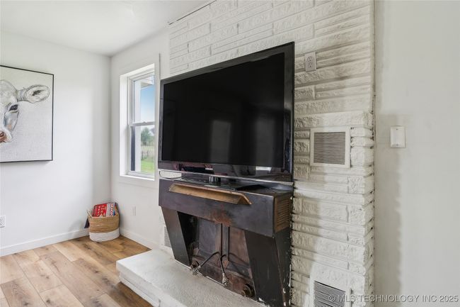 Detailed view of wood finished floors and baseboards | Image 16