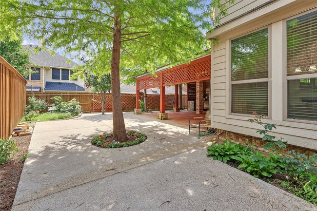 Fenced backyard featuring a patio area | Image 39