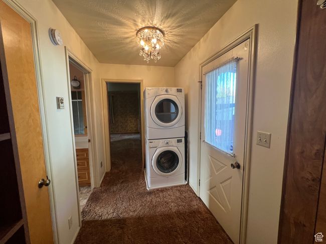 Stackable Laundry in the added "Master Bedroom" suite., hallway with extra storage and laundry chute to the bsmnt laundry area. | Image 14