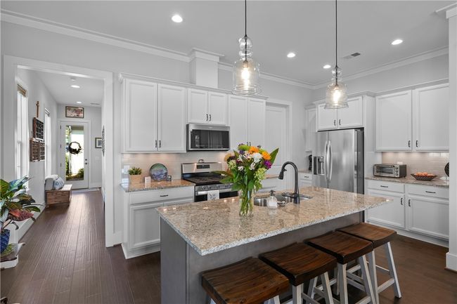 Kitchen that keeps in right in the middle of everything. | Image 4