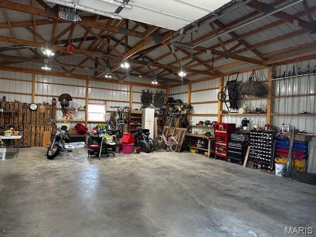 Garage featuring a workshop area | Image 19