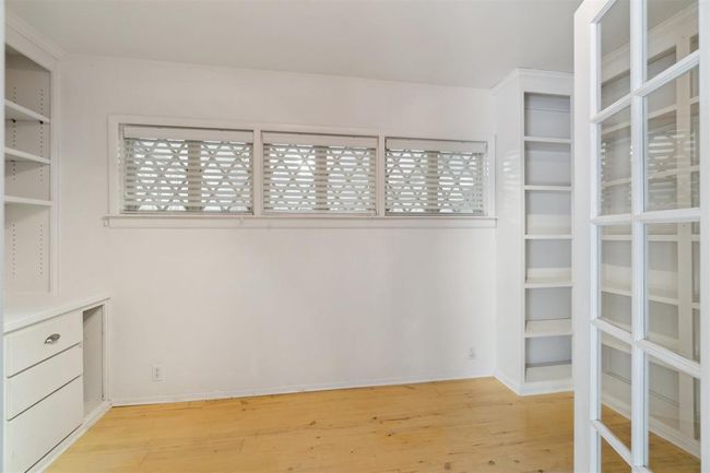 Walk in closet with light wood-type flooring | Image 23
