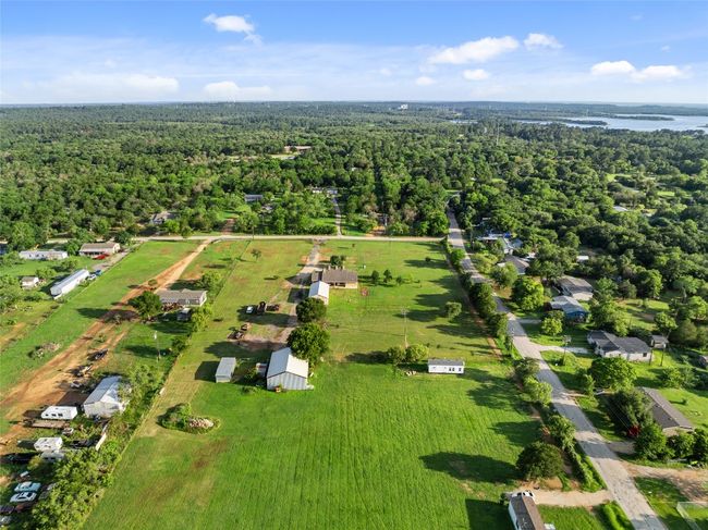 Aerial overview of property's location featuring a forest | Image 11