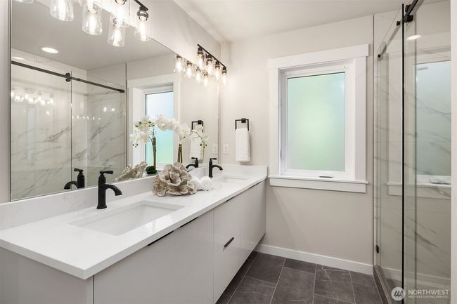 Luxurious en-suite bath in the primary suite. | Image 28