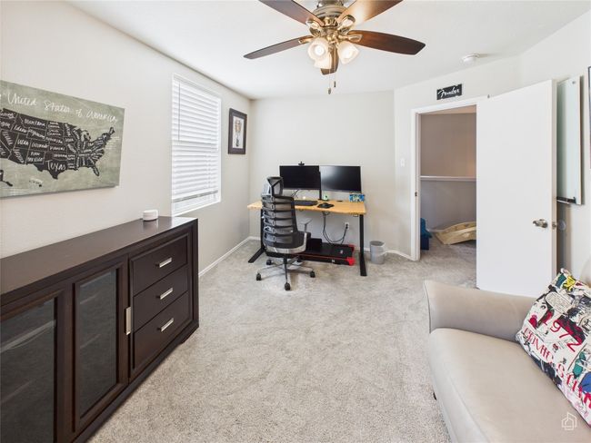 Home office featuring light carpet and a ceiling fan | Image 24