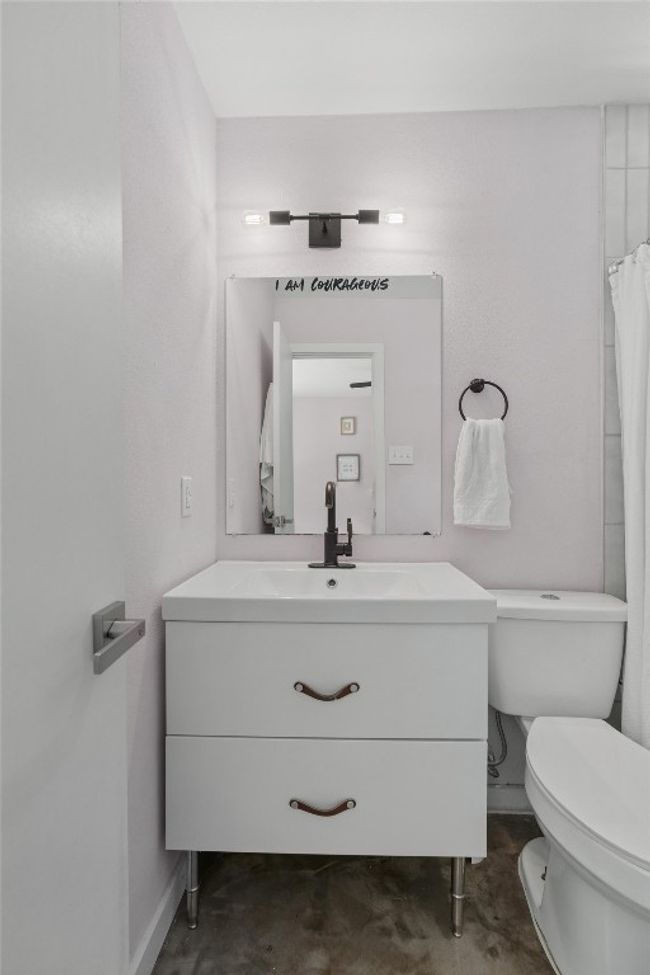 Bathroom featuring toilet, vanity, and baseboards | Image 17