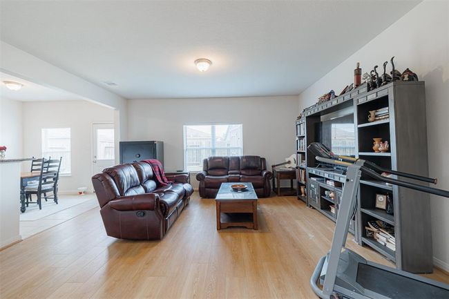 The family room is open to the kitchen and breakfast area. | Image 5