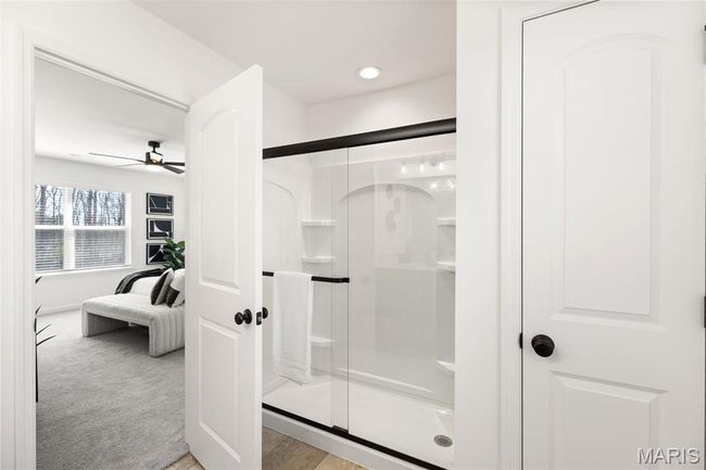 Full bath featuring a shower stall, a ceiling fan, and recessed lighting | Image 19
