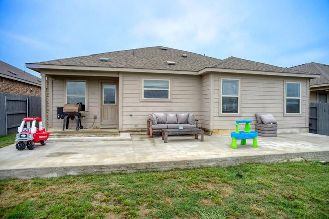 Back of property with a lawn, roof with shingles, fence, and a patio area | Image 34