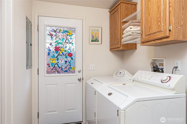 Laundry room with a door to the back porch | Image 20