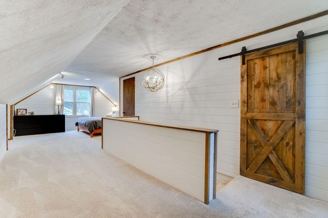 Statement light fixture and sliding barn door | Image 16