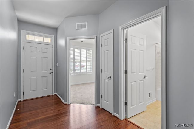 Foyer with wood finished floors and baseboards | Image 24