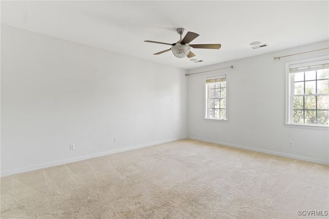 Empty room featuring ceiling fan and light carpet | Image 17