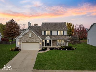 Beautiful Curb appeal with covered front sitting porch, neighborhood pool, park and paths | Image 1