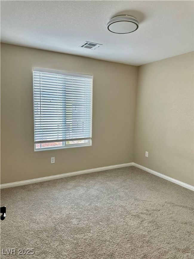 Spare room with baseboards, carpet, visible vents, and a textured ceiling | Image 25
