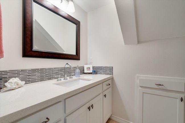 Bathroom with vanity and backsplash | Image 27