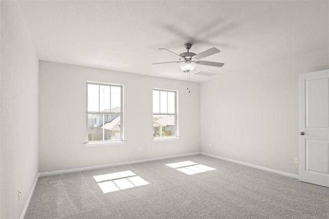 Unfurnished room featuring visible vents, baseboards, carpet flooring, and ceiling fan | Image 20