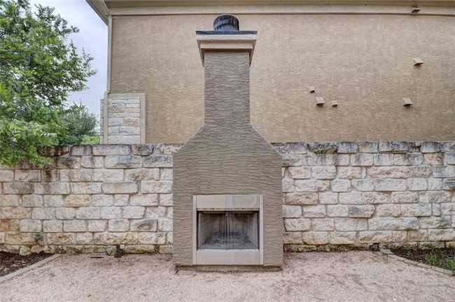 OUTSIDE WOOD BURNING FIREPLACE | Image 4
