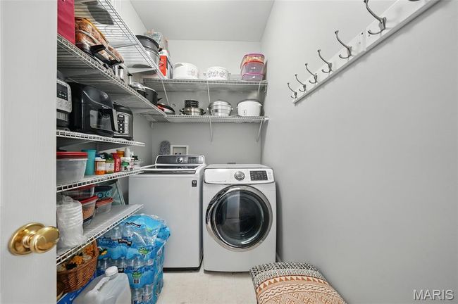 Laundry room with separate washer and dryer | Image 12