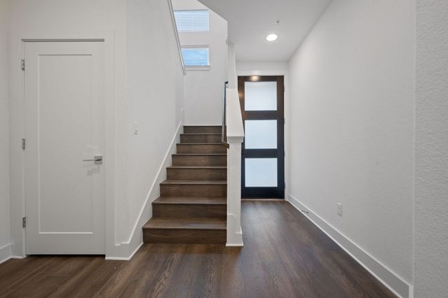 Stairs featuring wood finished floors and recessed lighting | Image 12