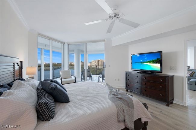 Master Bedroom Suite ~ Wake up to Gulf, Clam Bay and Pelican Bay skyline views. | Image 11