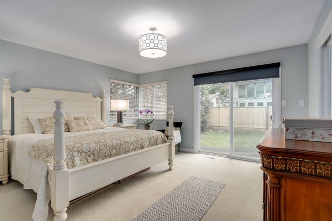 Bedroom featuring access to outside and carpet floors | Image 14