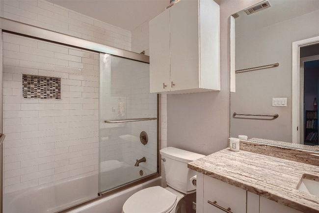 Bathroom with vanity and shower / bath combination with glass door | Image 10