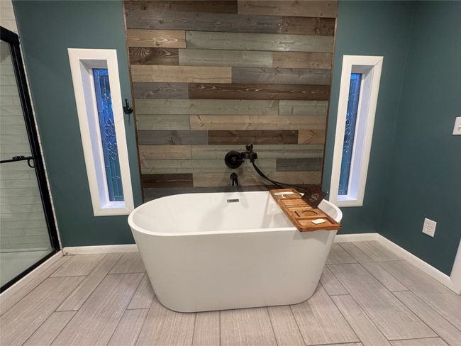 Bathroom featuring a stall shower | Image 10