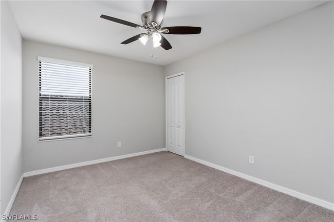 Carpeted empty room with ceiling fan | Image 18