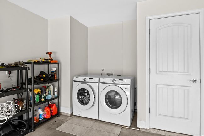 Laundry room with separate washer and dryer, baseboards, and tile patterned​​‌​​​​‌​​‌‌​‌‌​​​‌‌​​‌‌​‌​​​​​‌ floors | Image 19