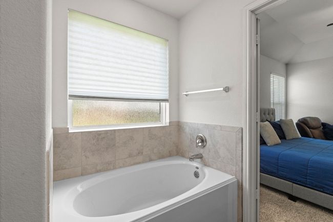 The large window with upgraded rain glass provides so much natural light. | Image 21